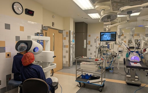 Dr. Lau testing the new surgery robot. 